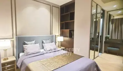 Luxurious bedroom with elegant decor and mirrored wardrobe