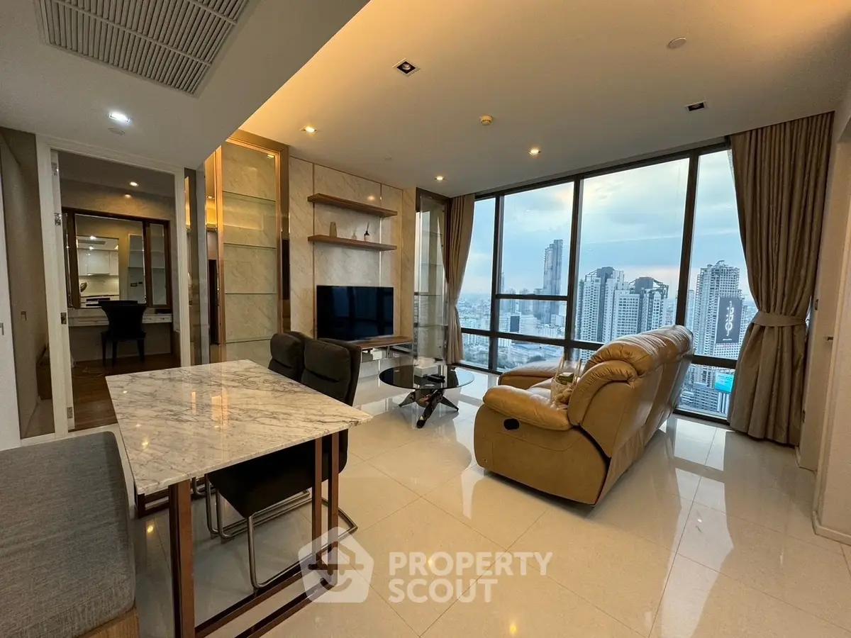 Luxurious high-rise living room with stunning city view and modern furnishings.