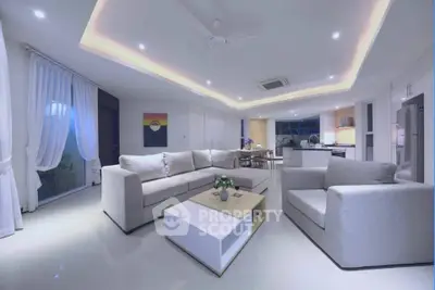 Luxurious modern living room with open kitchen and elegant lighting