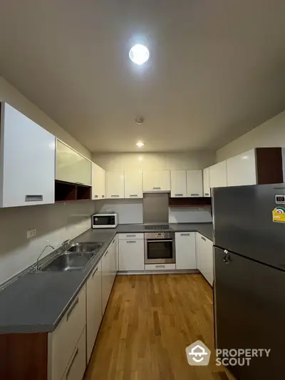 Modern kitchen with sleek cabinetry and stainless steel appliances