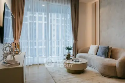 Modern living room with elegant decor and large window view