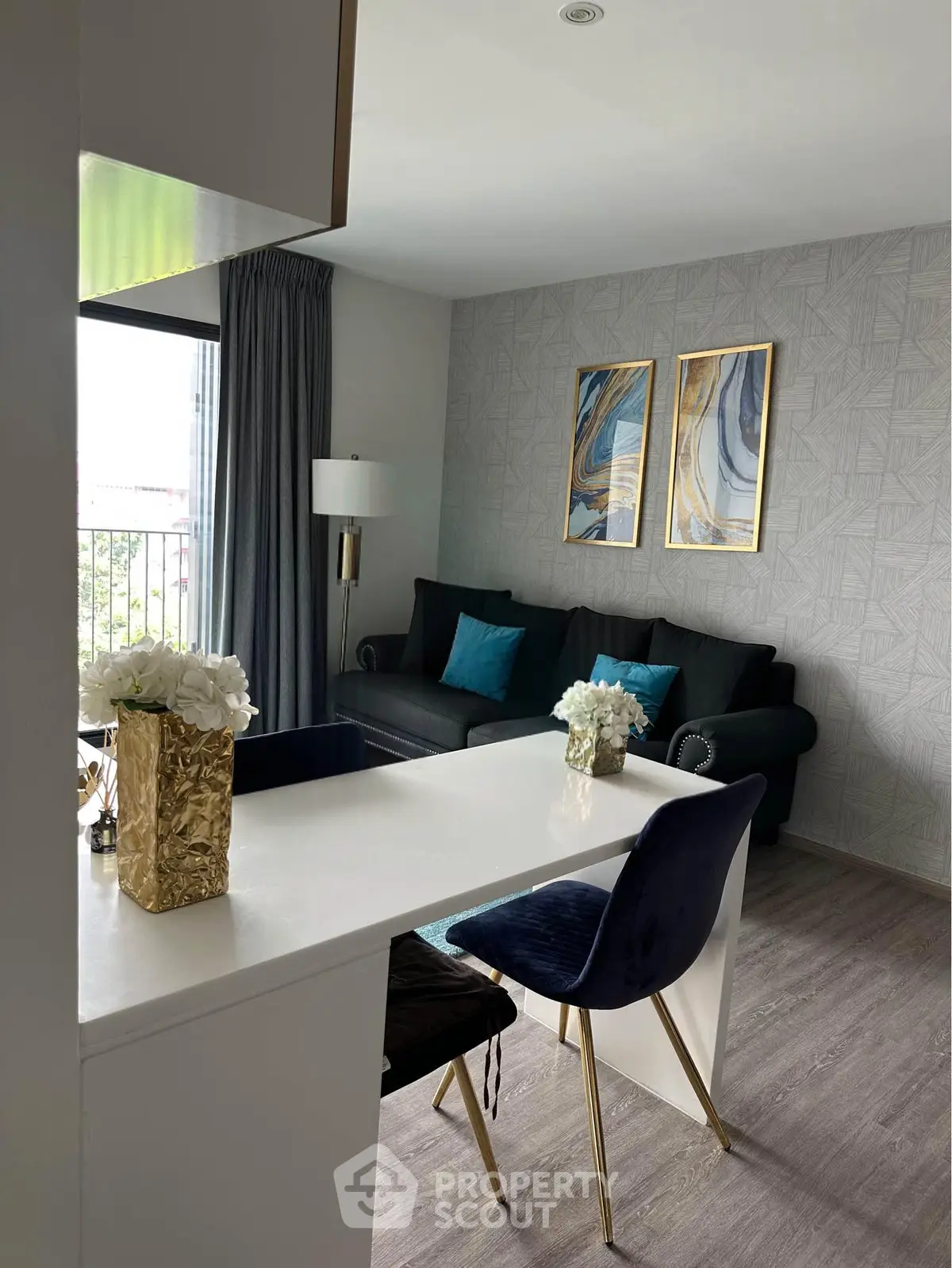 Stylish modern living room with elegant decor and open layout, featuring chic furniture and contemporary artwork.
