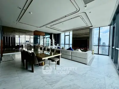 Luxurious modern living room with panoramic city views and elegant furnishings.