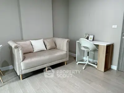 Modern living space with stylish sofa and compact study desk