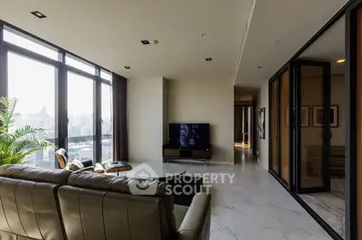 Luxurious living room with panoramic city views and modern furnishings