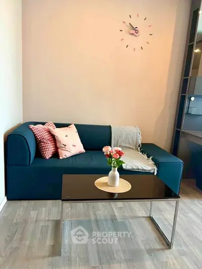Chic living room with modern sofa and stylish decor, perfect for cozy relaxation.