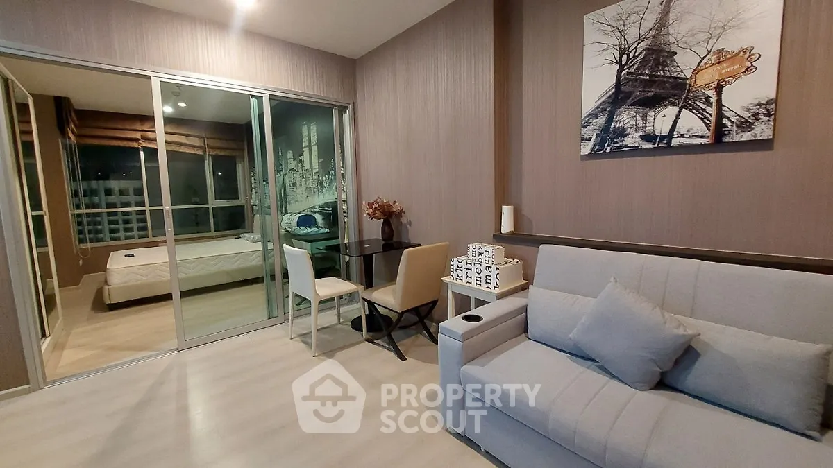 Modern living room with glass partition and cozy decor