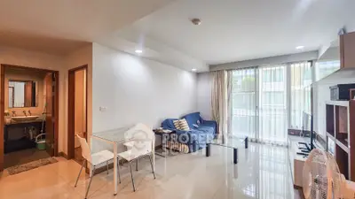 Modern living room with dining area and large windows in a cozy apartment