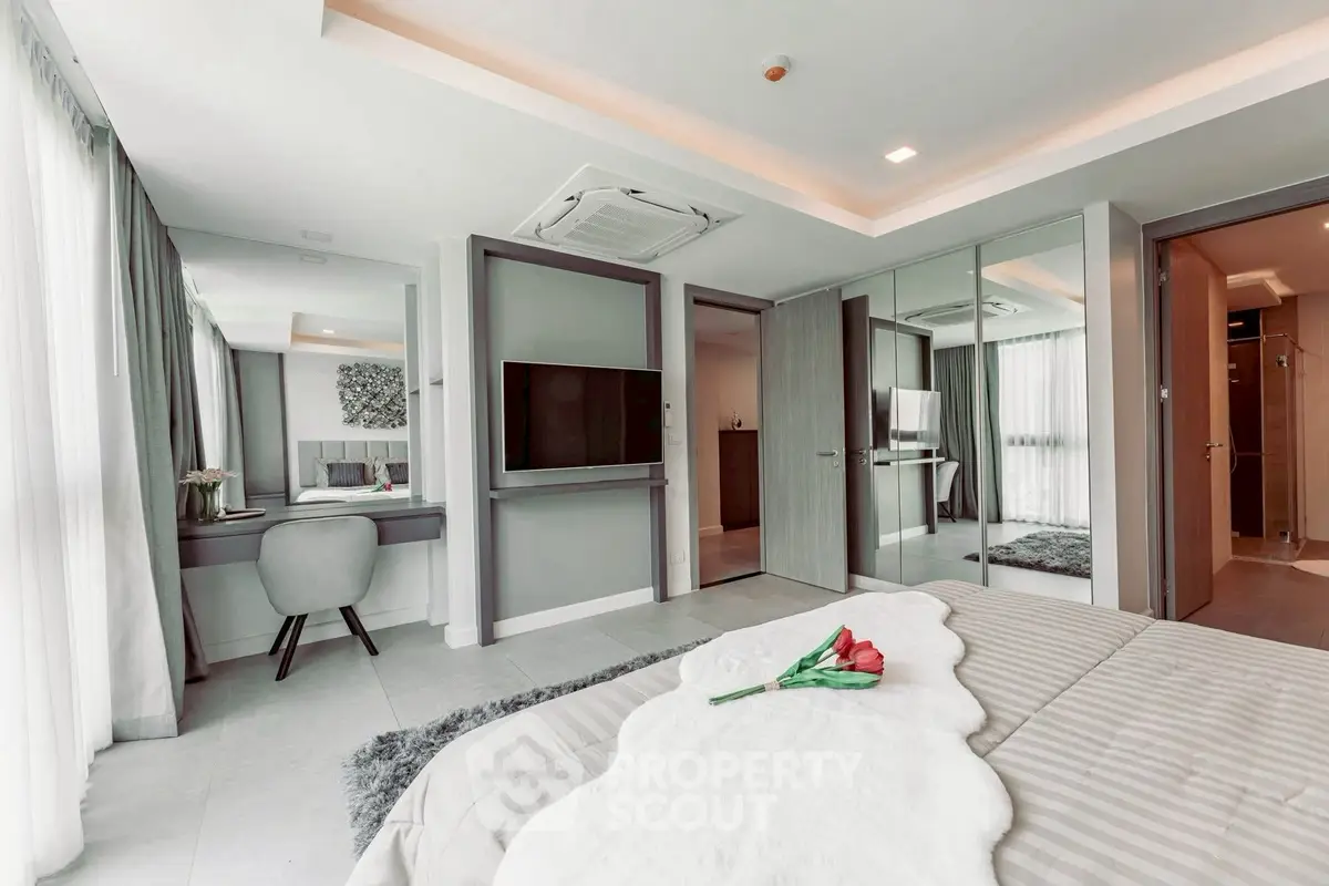 Luxurious modern bedroom with stylish decor and elegant furnishings, featuring a cozy bed and sleek design.