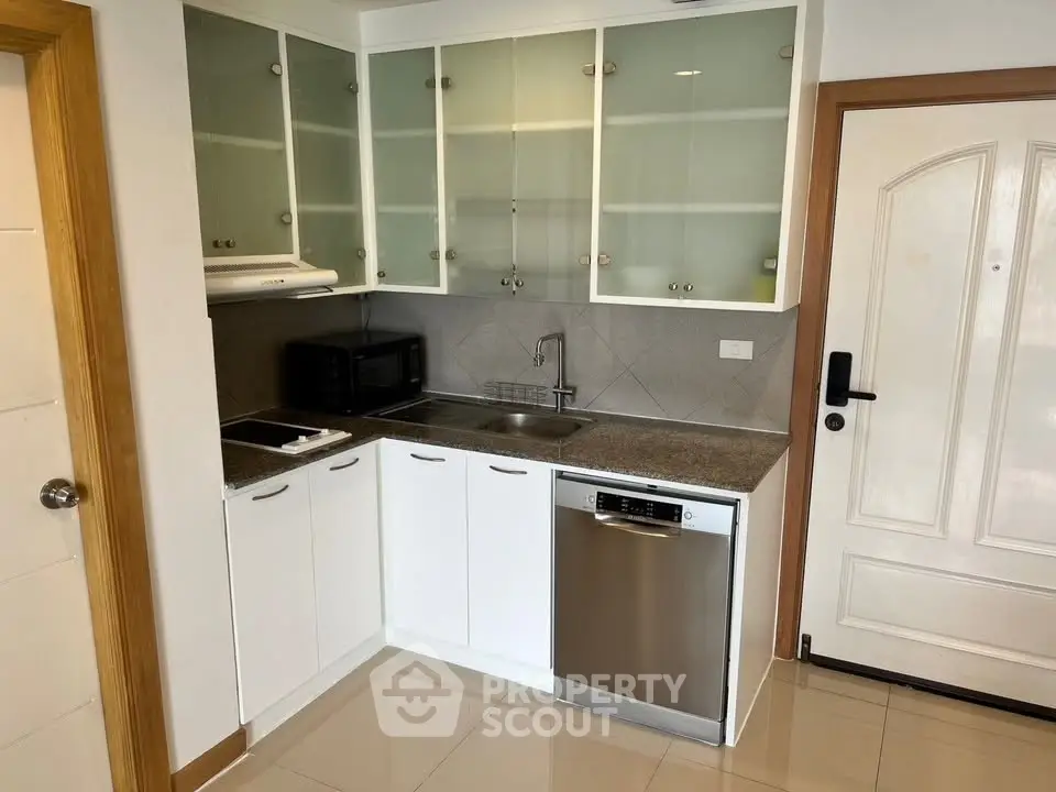 Modern kitchen with sleek cabinetry and stainless steel appliances