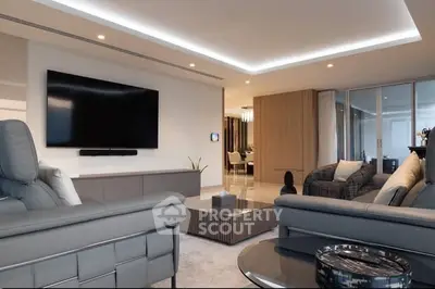 Luxurious modern living room with sleek furniture and large TV