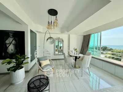 Luxurious living room with ocean view, elegant decor, and modern furnishings in a bright, spacious apartment.