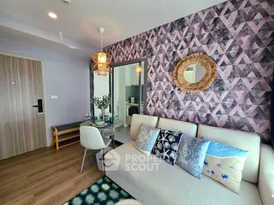 Stylish living room with geometric accent wall and cozy decor