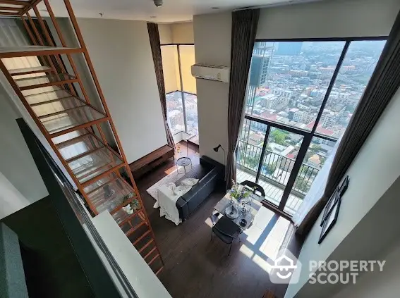 Stunning high-rise apartment with floor-to-ceiling windows and breathtaking city views.