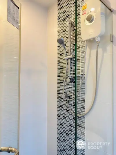 Modern bathroom shower with sleek tile design and water heater