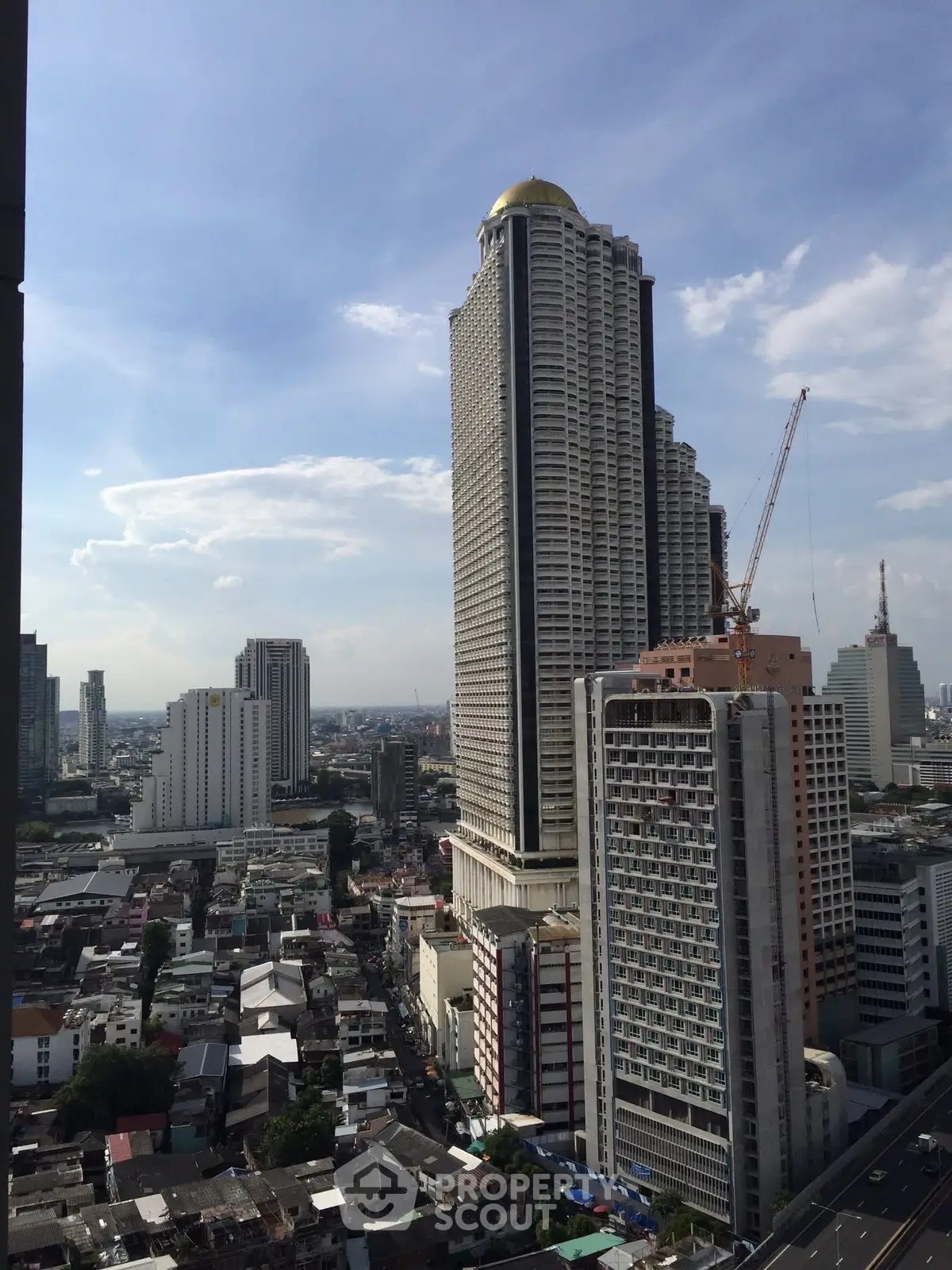 Stunning cityscape view with high-rise buildings and clear blue sky, perfect for urban living enthusiasts.