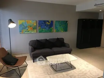 Modern living room with stylish furniture and colorful wall art