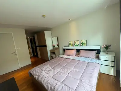 Spacious bedroom with modern decor and natural light