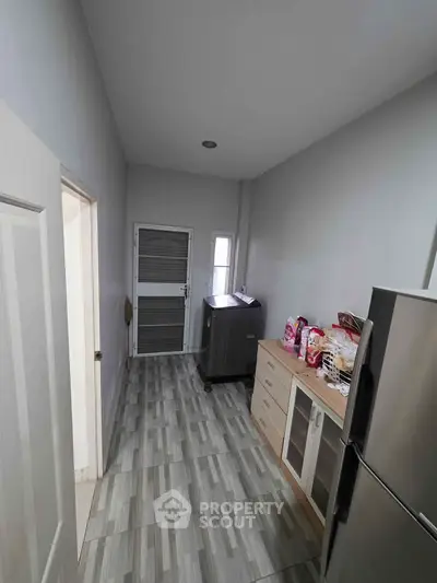 Modern kitchen with sleek appliances and ample storage space