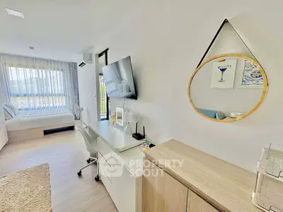 Modern studio apartment with stylish decor and natural light