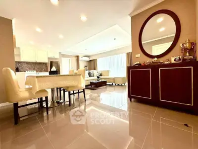 Spacious open-plan living room with elegant dining area and modern kitchen