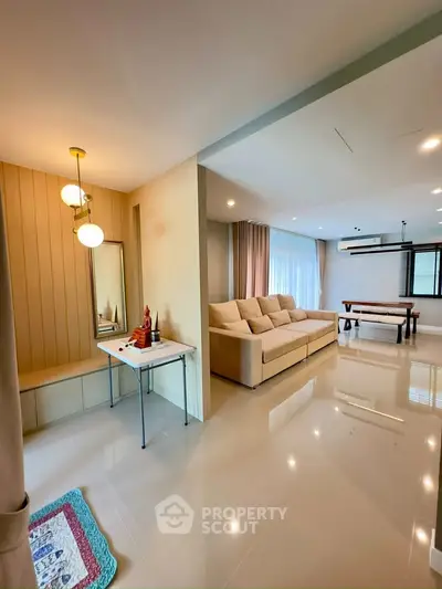 Spacious modern living room with elegant decor and ample natural light