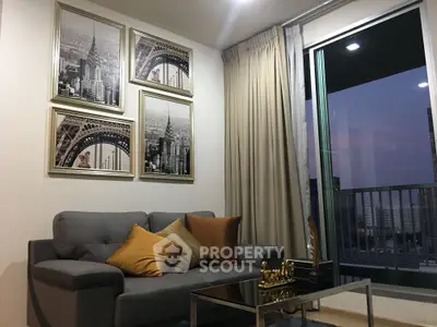 Modern living room with stylish decor and city view balcony at dusk