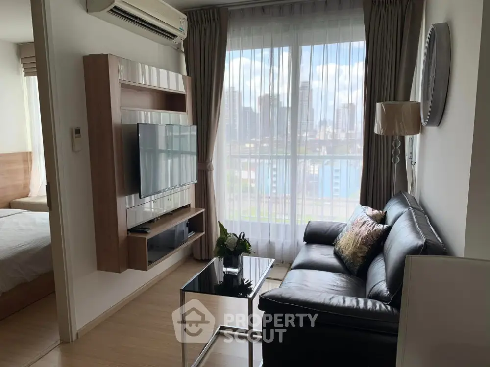 Modern living room with city view, sleek furniture, and natural light.