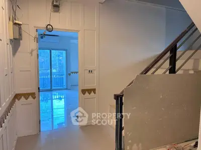 Spacious interior with staircase and balcony view, ideal for modern living.