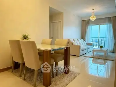 Elegant living room with dining area, plush seating, and a chandelier, perfect for modern living.