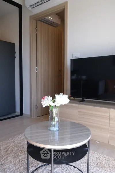 Modern living room with sleek TV unit and elegant decor