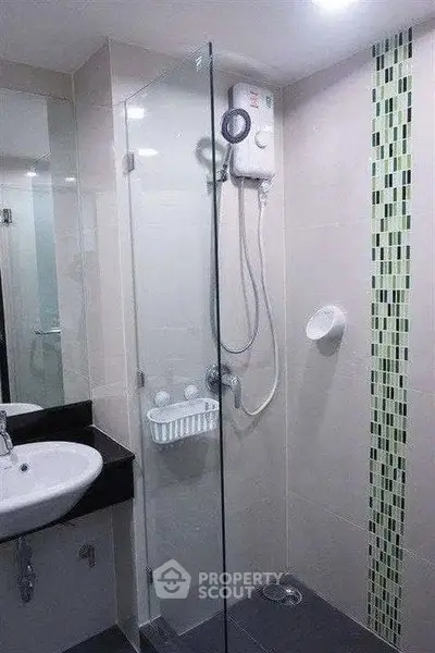 Modern bathroom with glass shower enclosure and sleek design