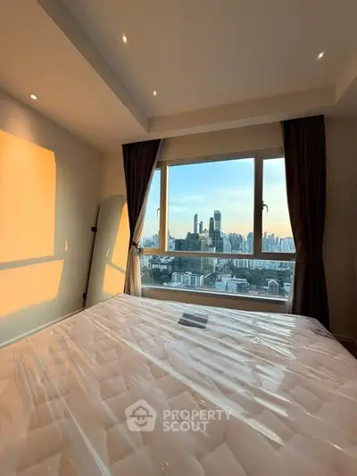 Stunning bedroom with panoramic city view and natural light