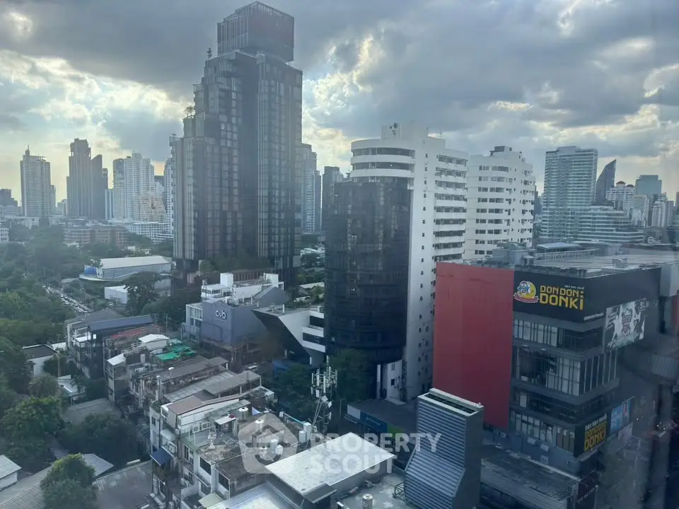 Stunning cityscape view showcasing modern high-rise buildings under a dramatic cloudy sky.