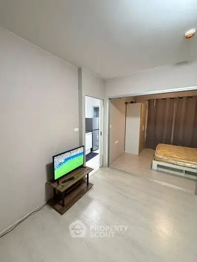 Modern studio apartment with open layout and cozy bedroom area.