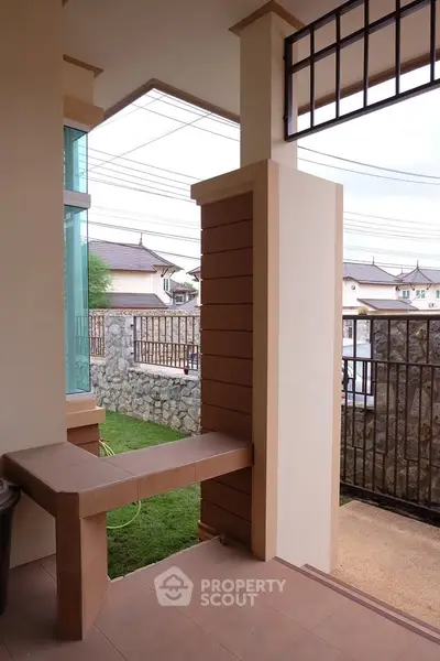 Charming residential entrance with modern design and stone wall accents