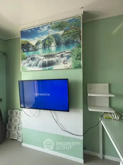 Modern living room with wall-mounted TV and scenic artwork, featuring sleek furniture and a serene color palette.