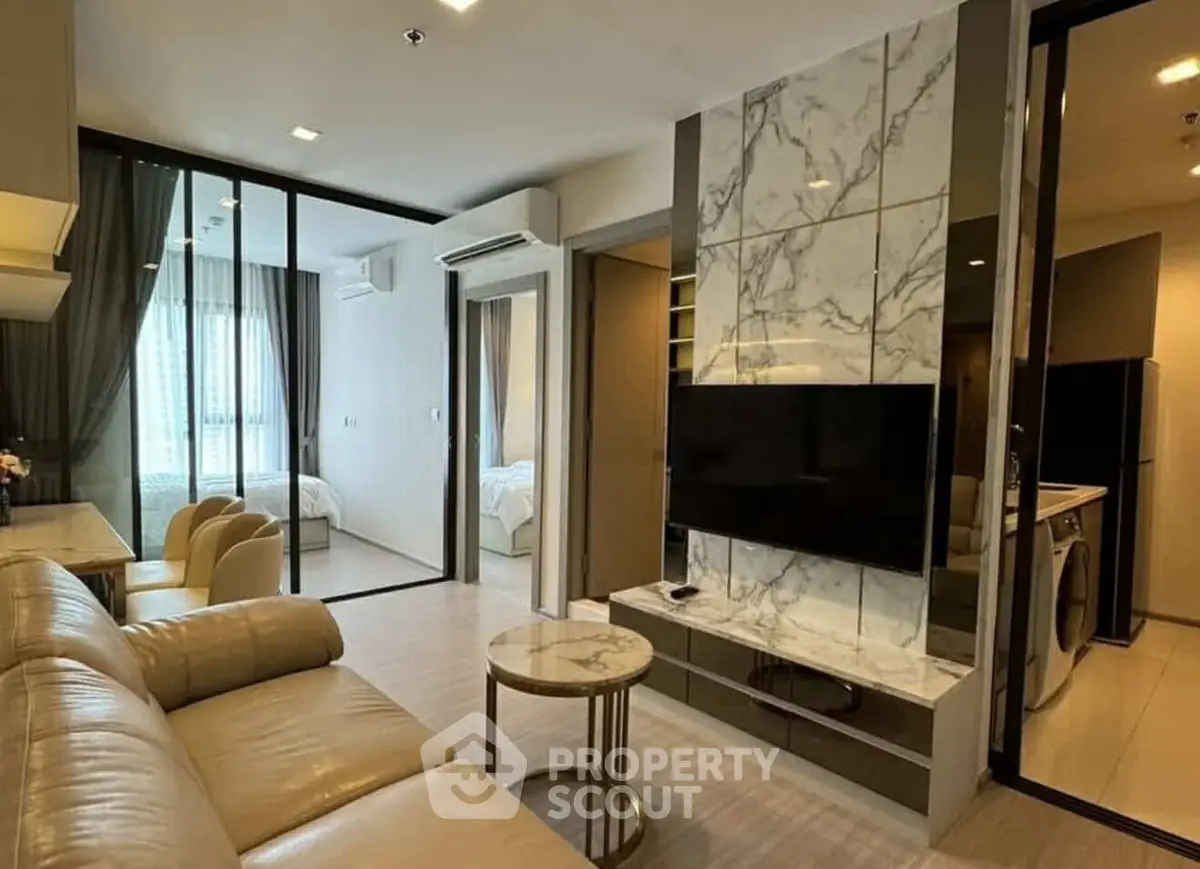 Modern living room with marble accent wall and open layout