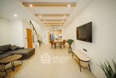 Spacious modern living room with open kitchen and stylish decor