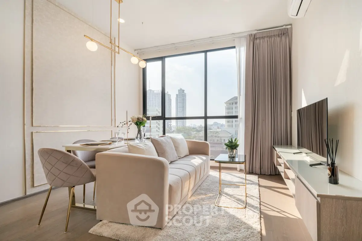 Luxurious modern living room with elegant decor and city view, featuring plush sofa and stylish lighting.