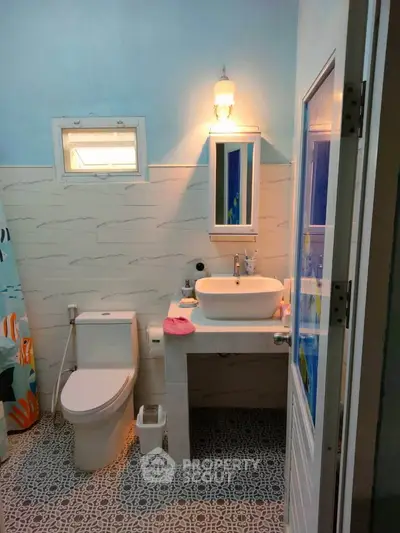 Charming bathroom with modern fixtures and stylish tile flooring