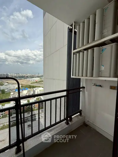 High-rise balcony with city view and air conditioning units