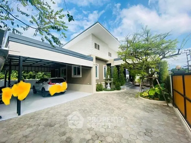 Modern house exterior with carport and landscaped driveway