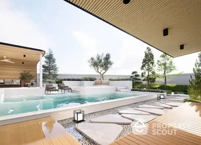 Luxurious modern poolside area with elegant landscaping and stylish outdoor seating.