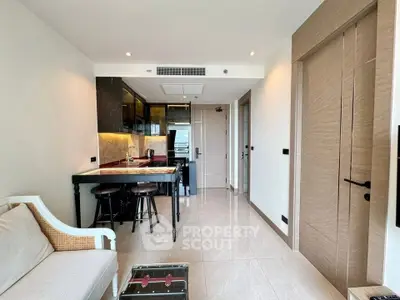 Modern open-layout living room with stylish kitchen and elegant decor