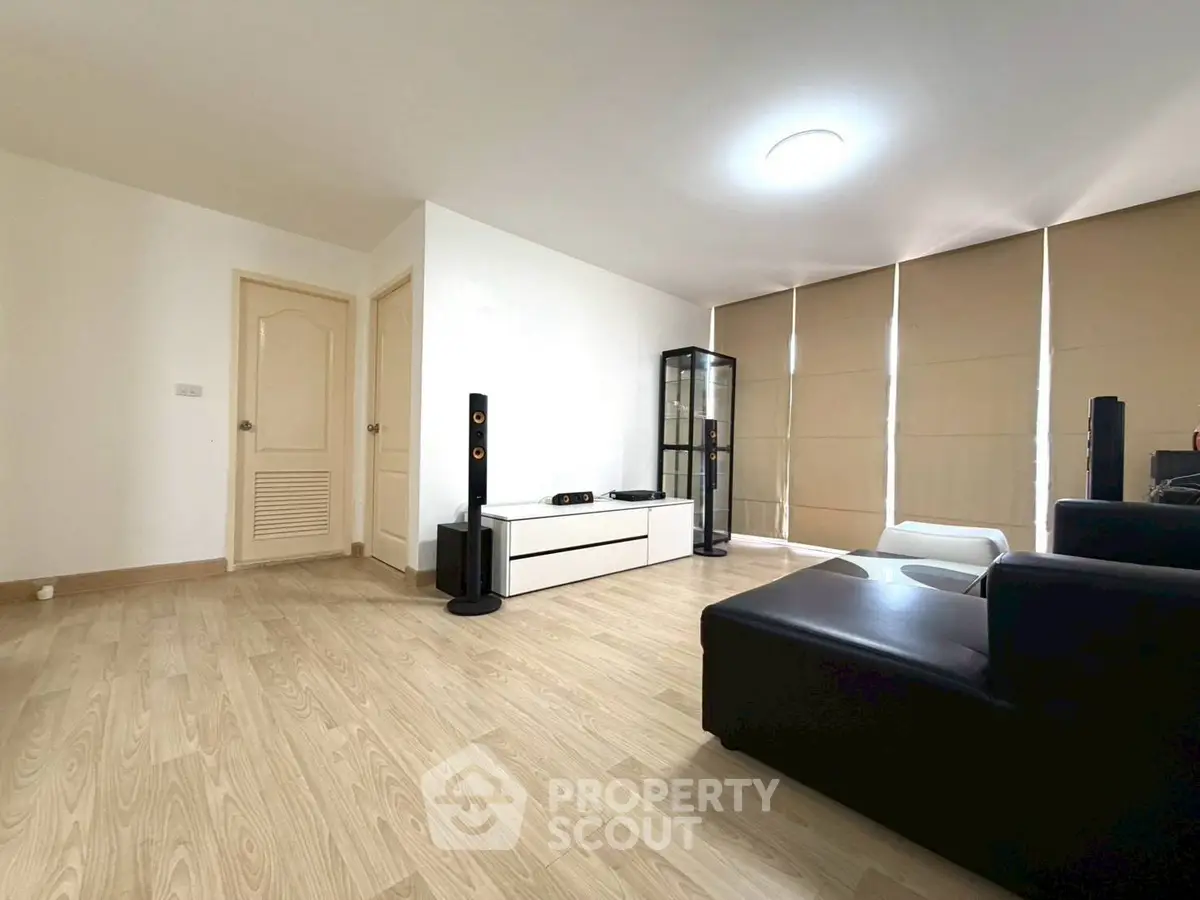 Spacious modern living room with sleek furniture and natural light