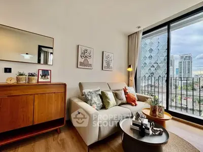 Modern living room with stylish decor and city view from large window.