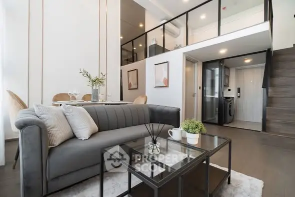 Modern duplex living room with stylish decor and mezzanine level