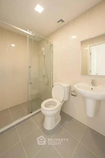 Modern bathroom with glass shower and sleek fixtures