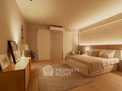 Luxurious bedroom with modern decor and ambient lighting, featuring a cozy bed and stylish furnishings.